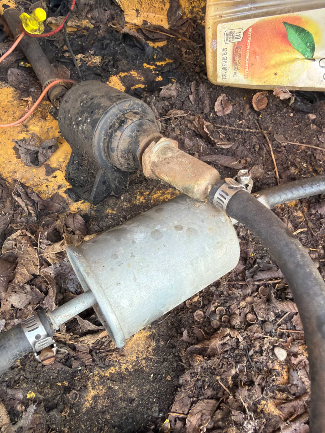 Inline fuel filter and canister in the fuel line, hose-clamped