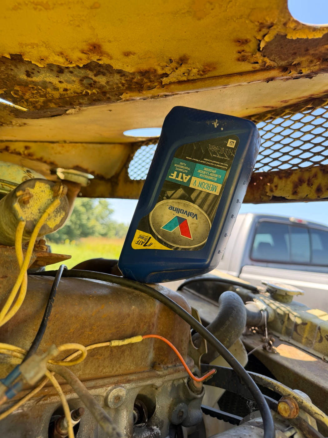 Pouring Valvoline ATF in, plug holes open in the head