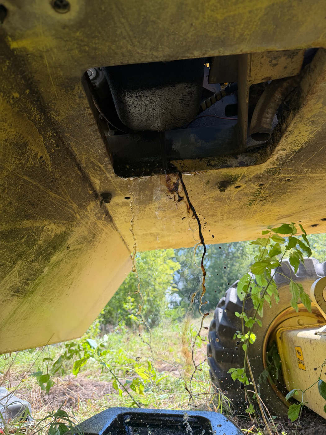 Oil pan access hatch from underneath, before pulling the drain plug