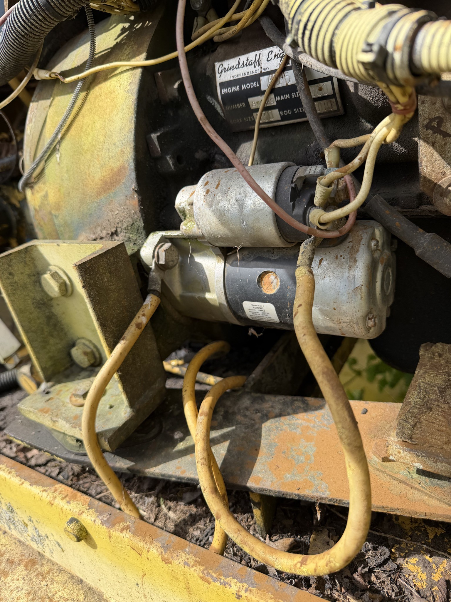 Starter motor still mounted below the Grindstaff Engines tag reading ENGINE MODEL A15, NUMBER 85029