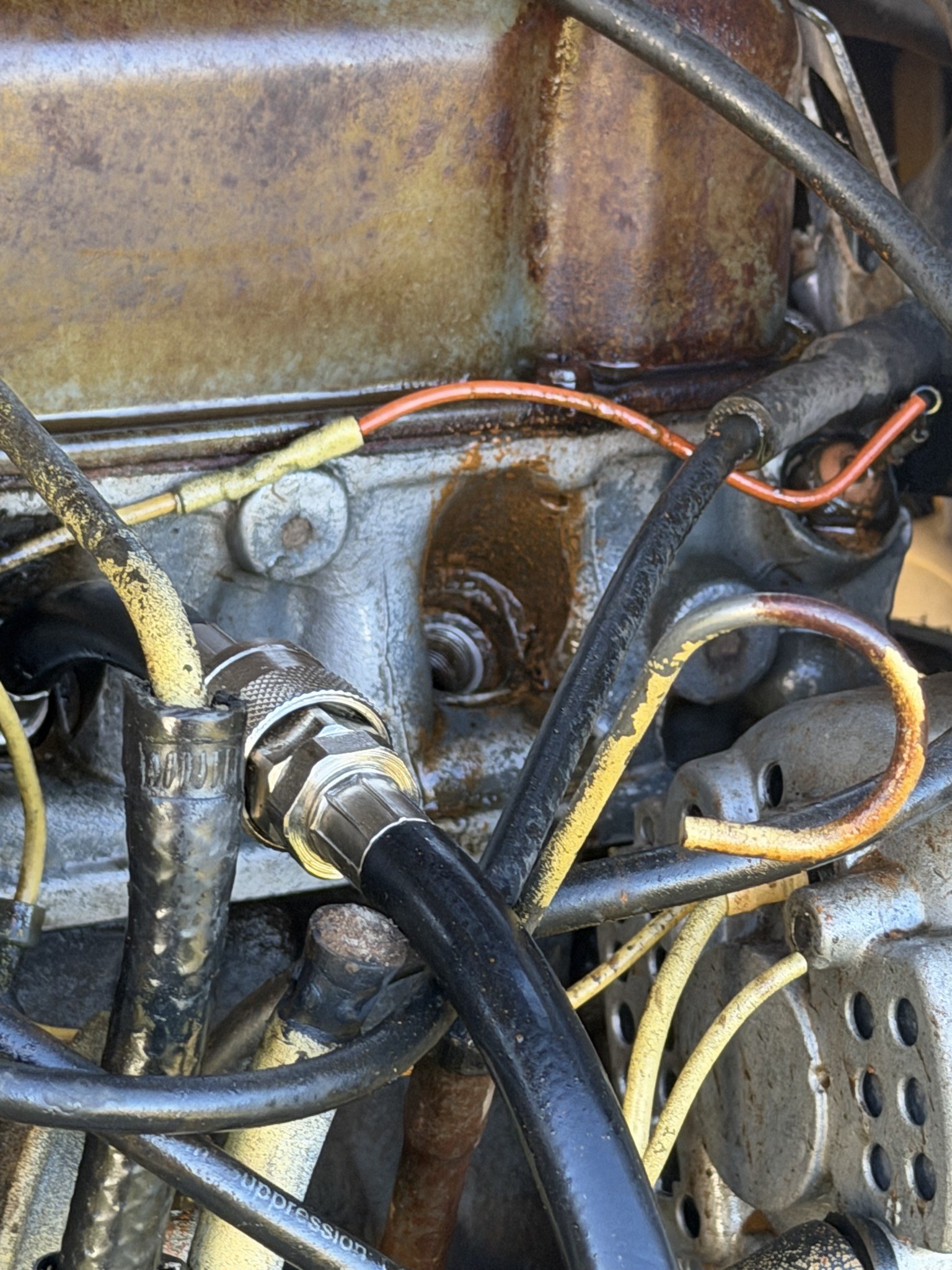 Compression tester adapter threaded into a plug hole