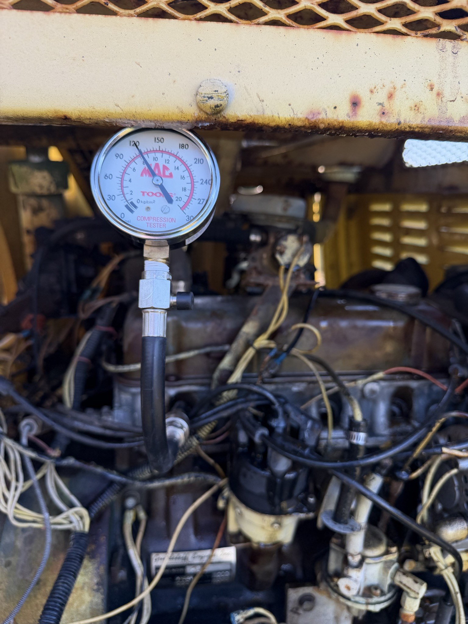 Compression gauge, pointer on the 120 numeral