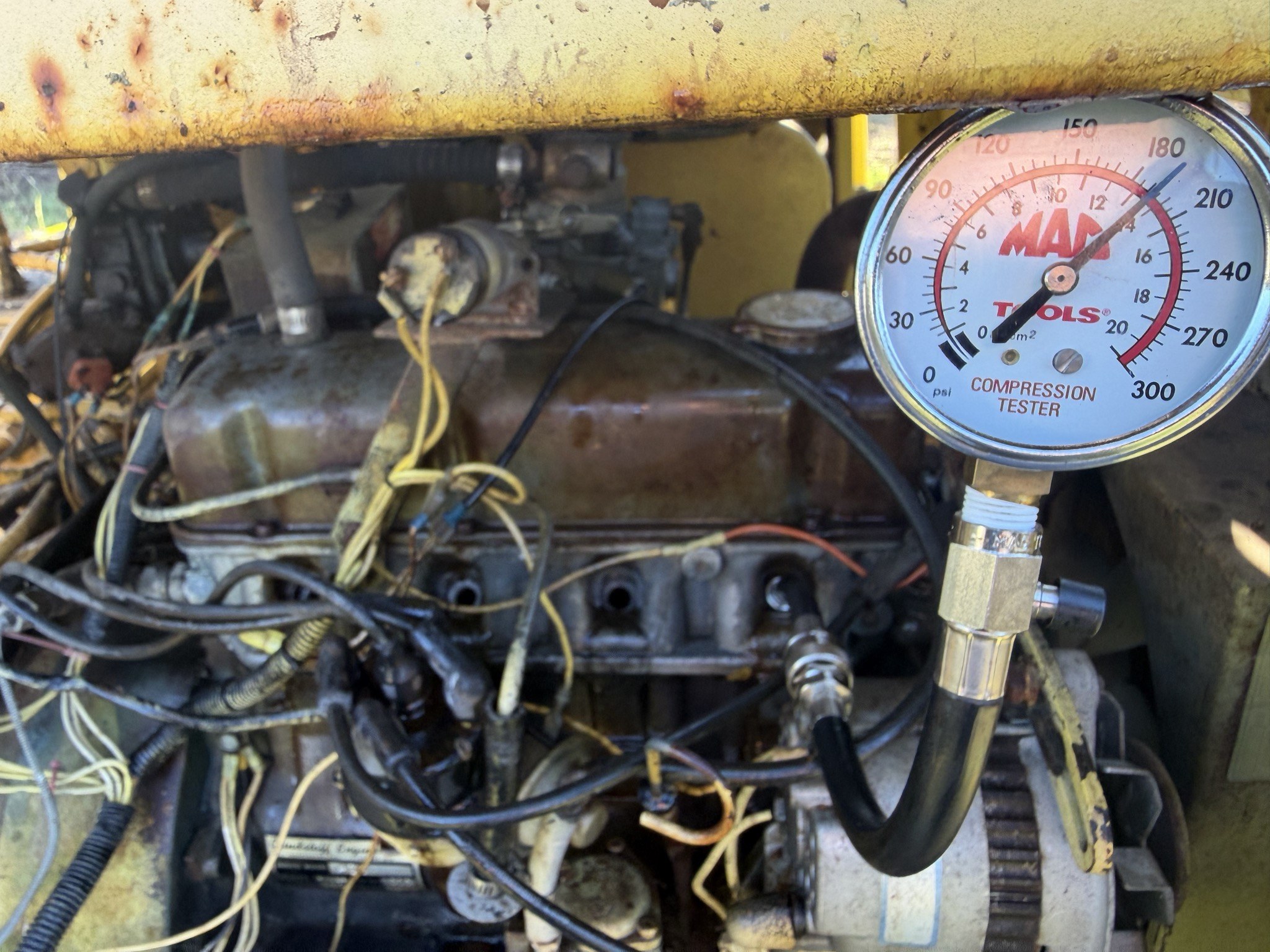 Compression gauge, pointer just past the 180 numeral