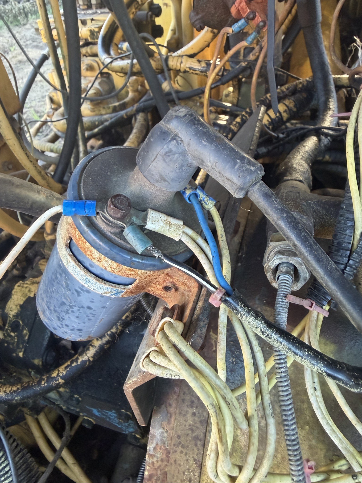 Ignition coil mounted in the engine bay with the HT lead off